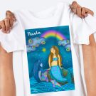 Mermaid and Ocean Friends in Rainshower Kids T-Shirt held in womans hands at Hush the Moon