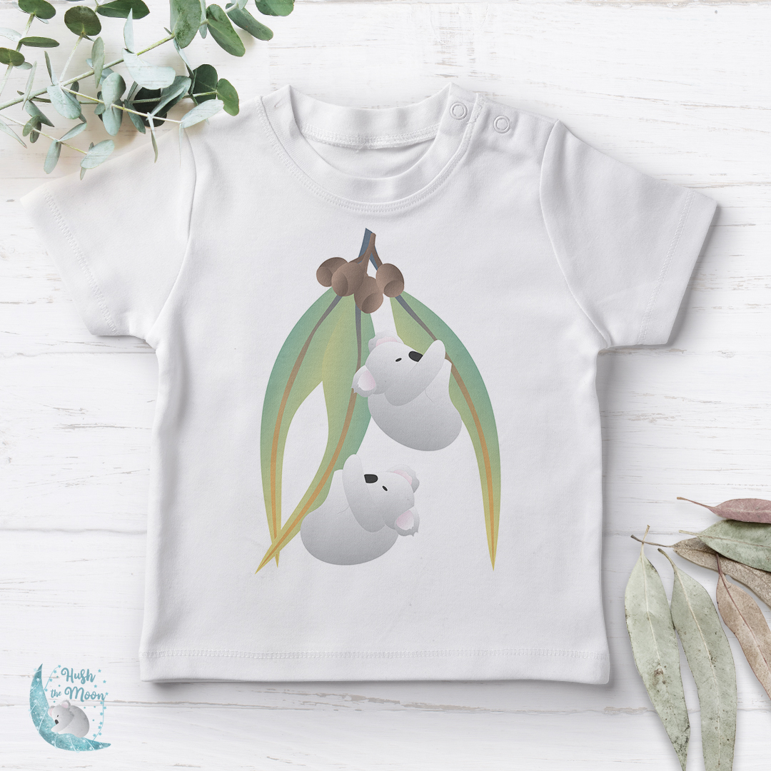 Koalas on Gum Leaves Baby T-Shirt Flat Lay