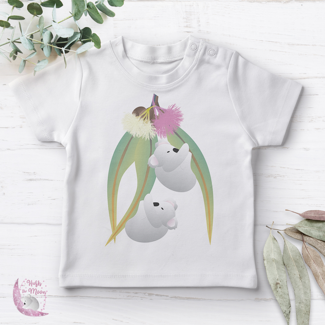 Koalas on Gum Leaves with Blossom on Baby T-Shirt Flat Lay